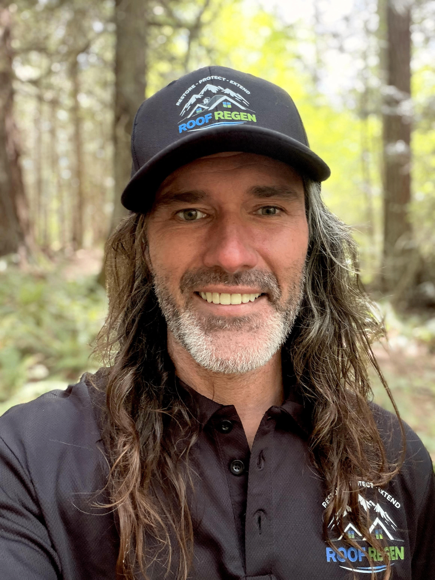 Ben Harrison, owner of Roof Regen, in branded cap and shirt